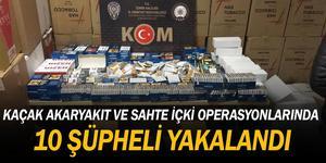 İzmir'de düzenlenen operasyonlarda 9 bin 500 litre akaryakıt, 9 bin 268 şişe kaçak alkollü içki, 2 bin 21 litre sahte etil alkol ele geçirildi.  ( İzmir İl Emniyet Müdürlüğü - Anadolu Ajansı )
